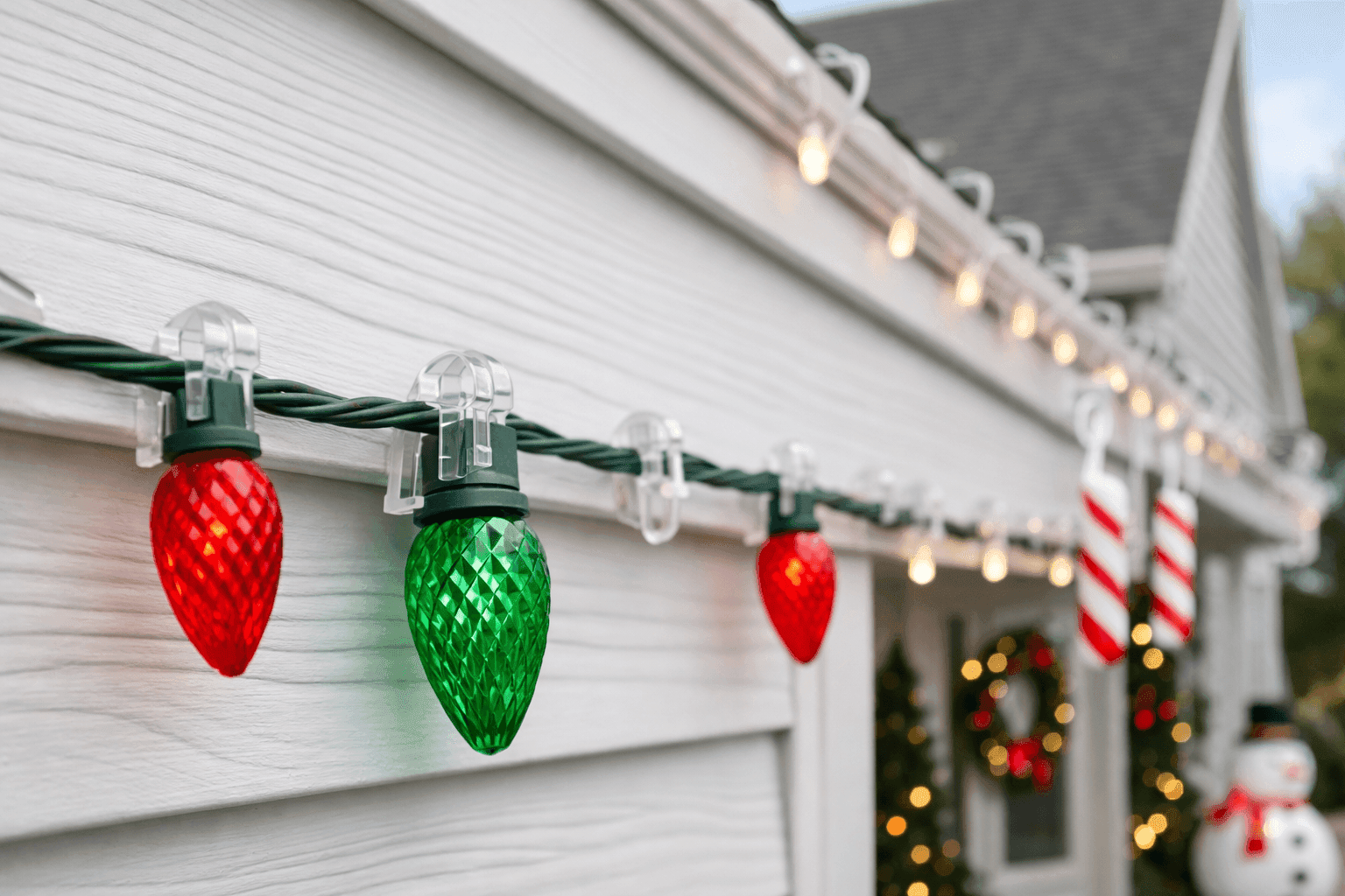 Holiday lights and decor safely hung on house siding with plastic hooks